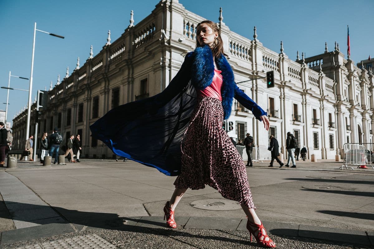 Editorial fashion walking scene in urban environment
