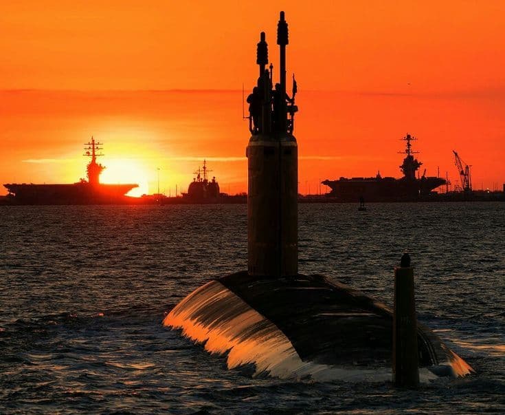 Modern research vessel at sea during sunset